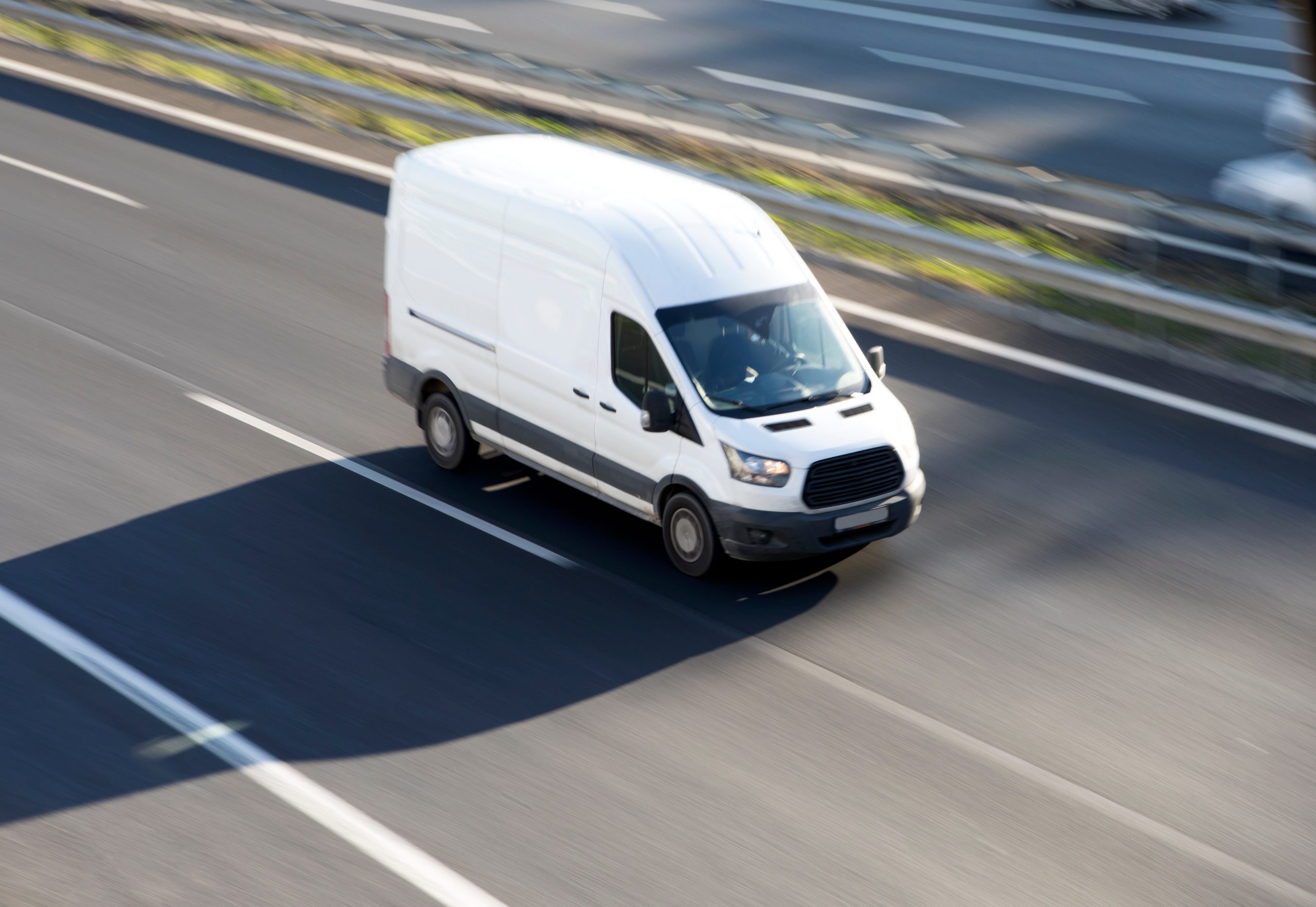 Cargo van in transit, illustrating the need for Goods in Transit Insurance protection
